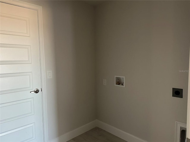 clothes washing area featuring hookup for an electric dryer, hookup for a washing machine, and dark hardwood / wood-style flooring