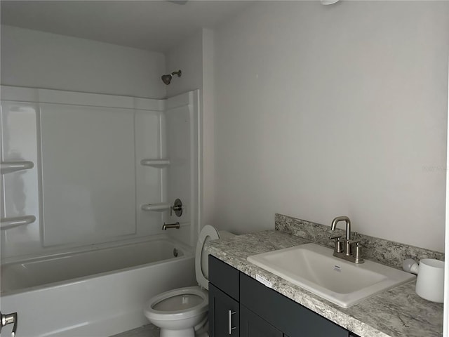 full bathroom with washtub / shower combination, vanity, and toilet