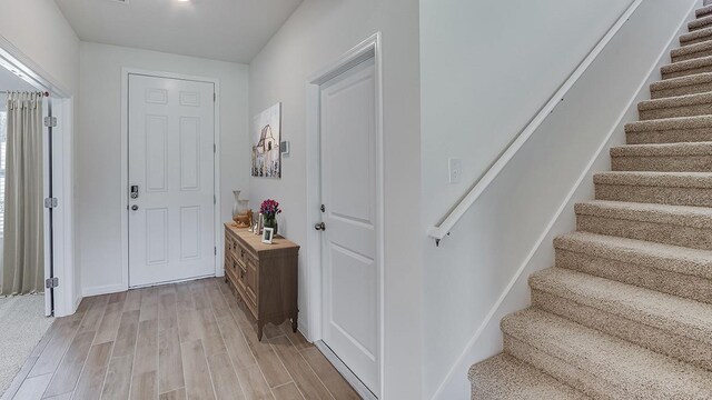 foyer entrance with light hardwood / wood-style flooring