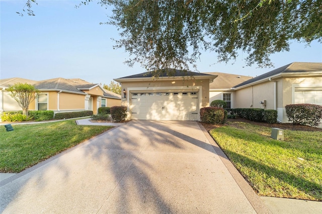 ranch-style house featuring a garage and a front lawn