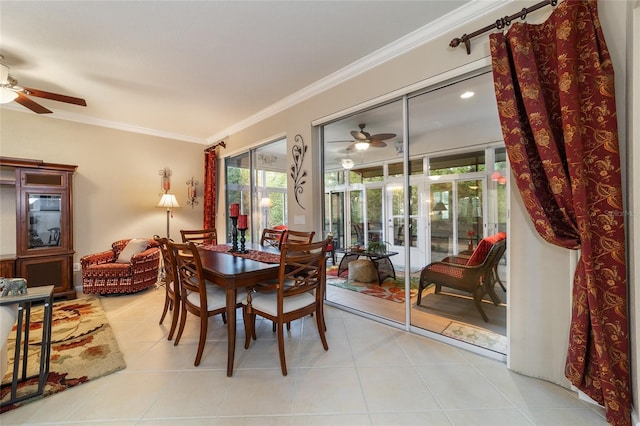 dining room with ceiling fan, light tile patterned flooring, and ornamental molding