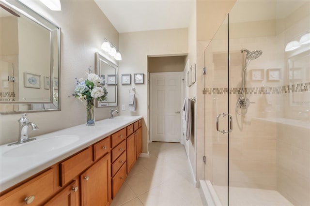 bathroom with vanity, tile patterned floors, and walk in shower