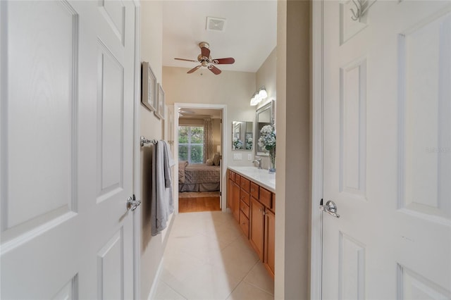 bathroom featuring ceiling fan, tile patterned flooring, and vanity