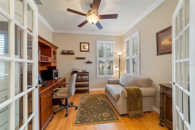 office area with ceiling fan, light hardwood / wood-style flooring, french doors, and ornamental molding