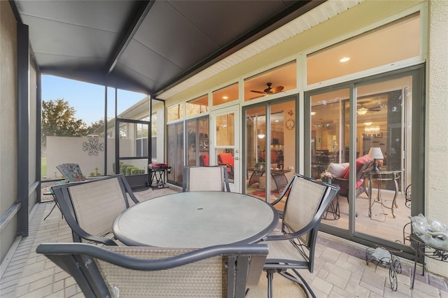 sunroom featuring vaulted ceiling