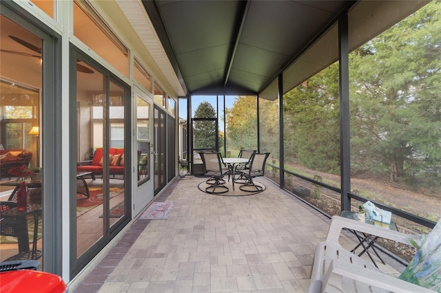 unfurnished sunroom with vaulted ceiling