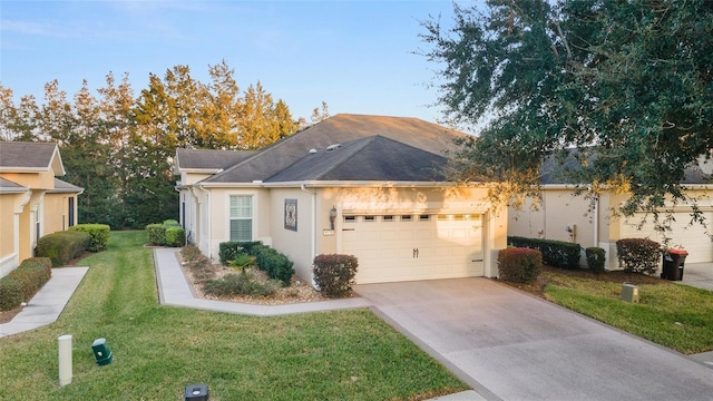 view of front of home featuring a front yard and a garage