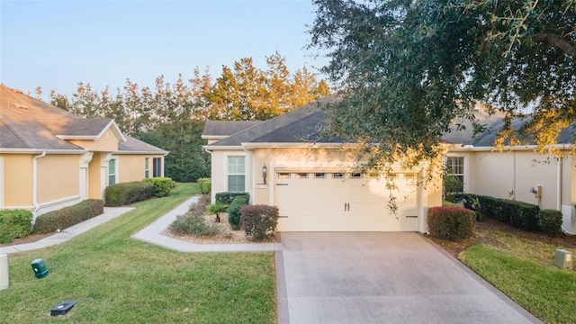 ranch-style house with a front yard and a garage