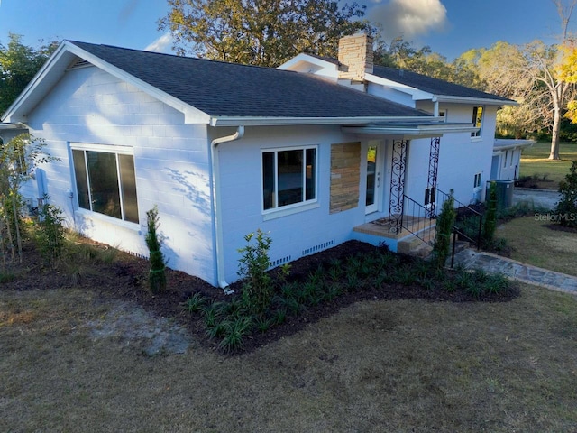 ranch-style home with a front lawn