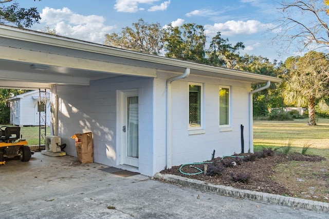 exterior space with a carport