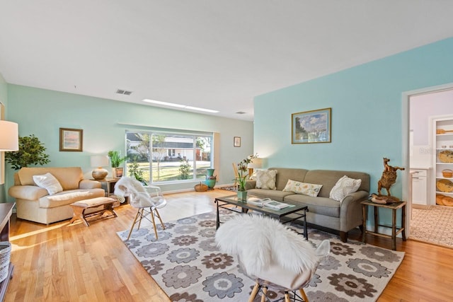 living room with light hardwood / wood-style floors