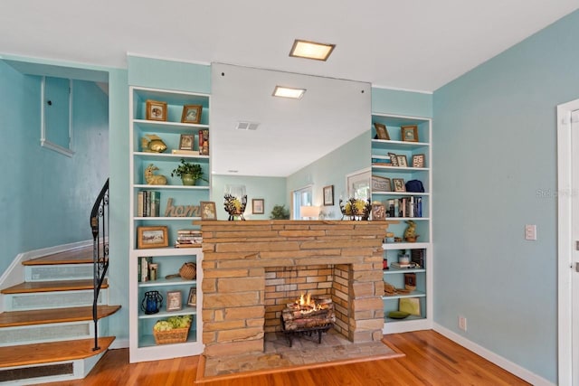 interior space featuring a fireplace and hardwood / wood-style flooring