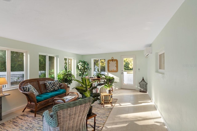 sunroom featuring a wall mounted AC