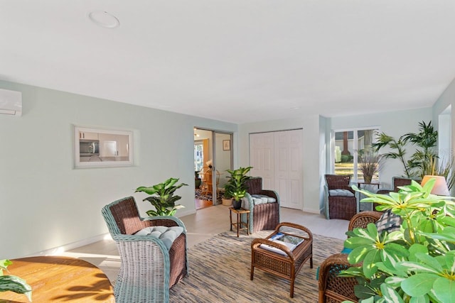 living room featuring a wall unit AC