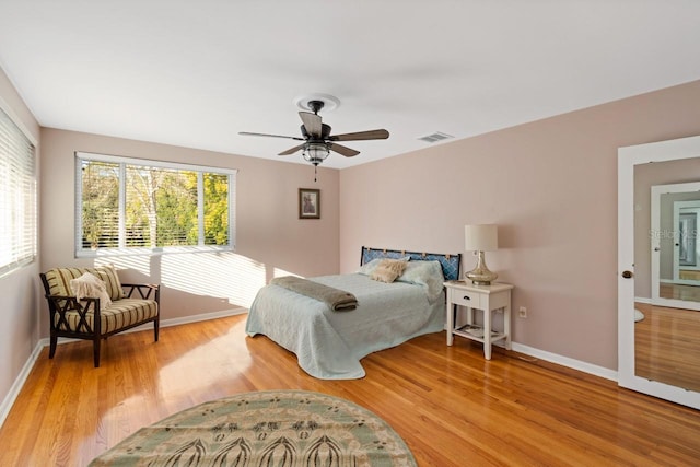 bedroom featuring light hardwood / wood-style flooring and ceiling fan