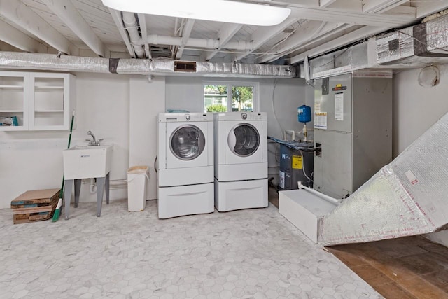 washroom with washing machine and dryer and heating unit