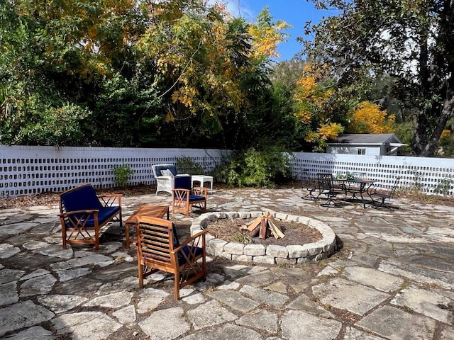 view of patio / terrace featuring an outdoor fire pit