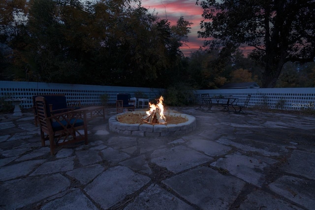 patio terrace at dusk with an outdoor fire pit