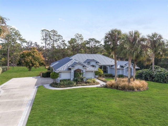 single story home featuring a front lawn