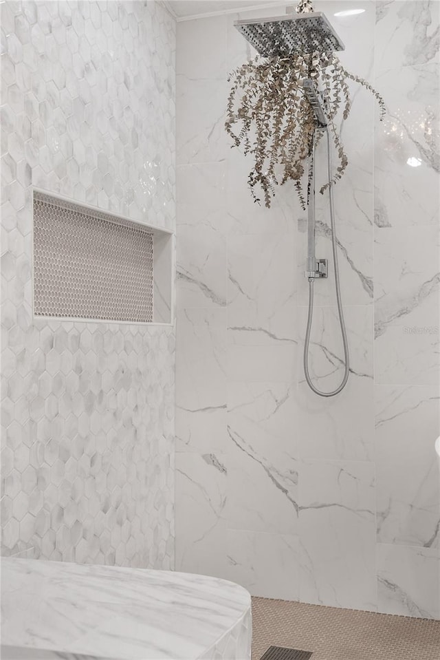 bathroom featuring tiled shower