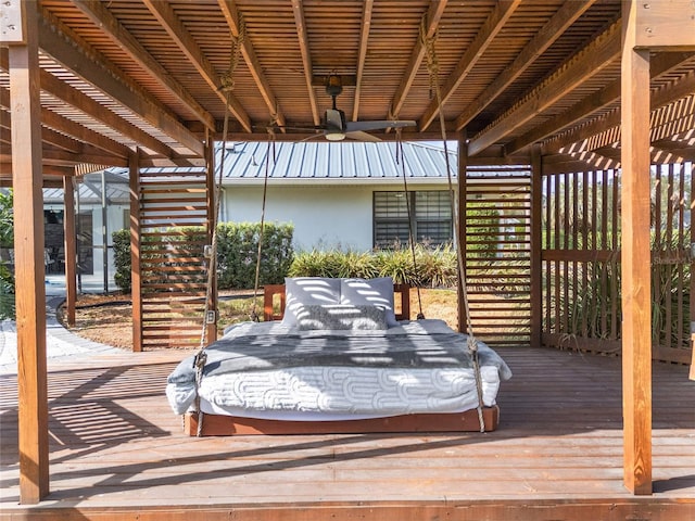 wooden terrace featuring ceiling fan