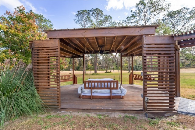 view of home's community featuring a lawn and a wooden deck