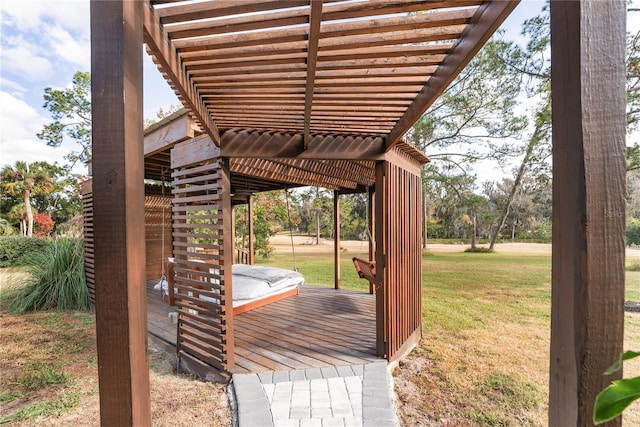 wooden deck featuring a hot tub and a yard