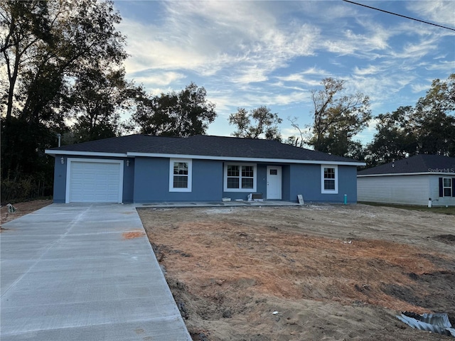 single story home with a garage