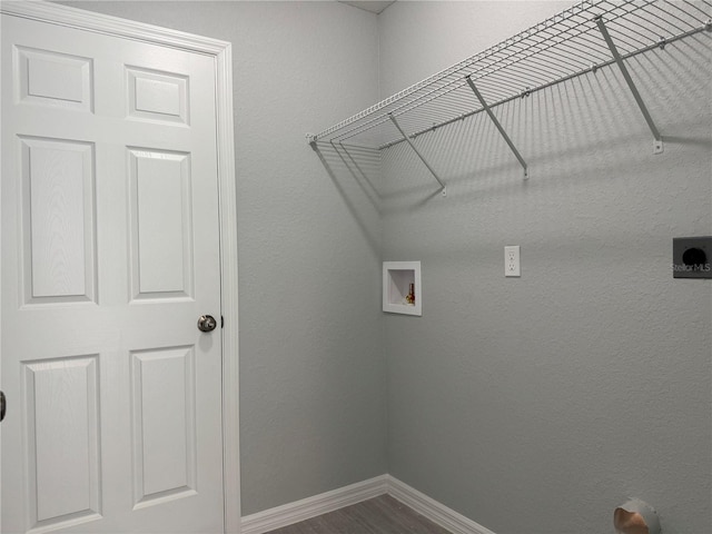 laundry area featuring hookup for an electric dryer, hookup for a washing machine, and hardwood / wood-style flooring