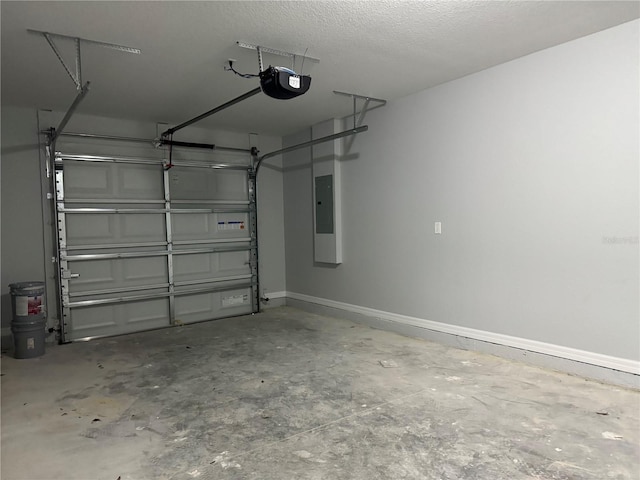 garage with electric panel and a garage door opener