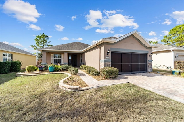 view of front facade featuring a garage and a front lawn