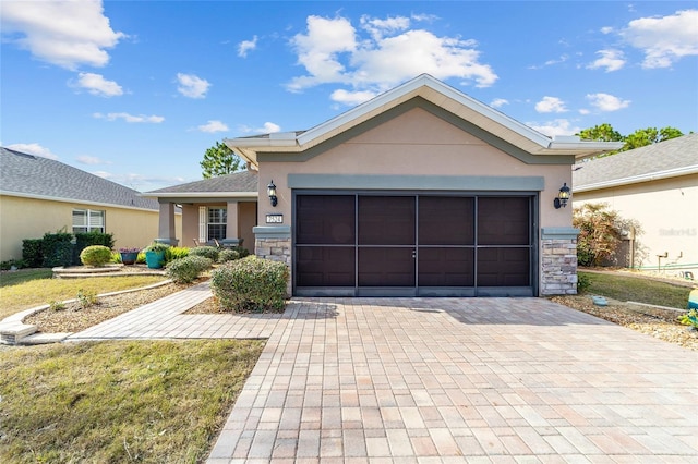 view of front facade with a front lawn and a garage