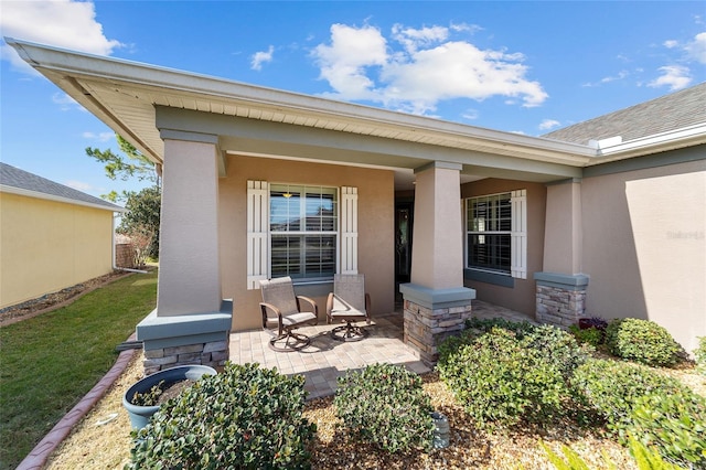 property entrance featuring a porch