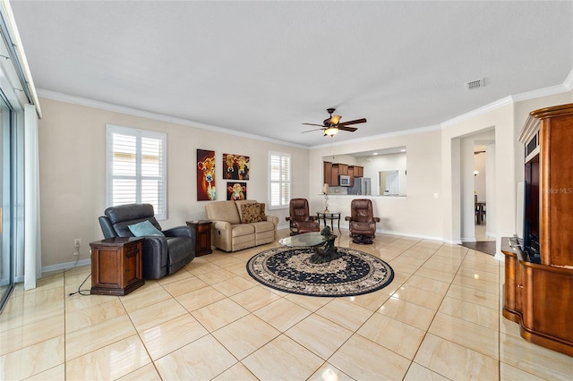 living room featuring ceiling fan, ornamental molding, and light tile patterned floors