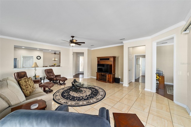 tiled living room with ceiling fan and ornamental molding