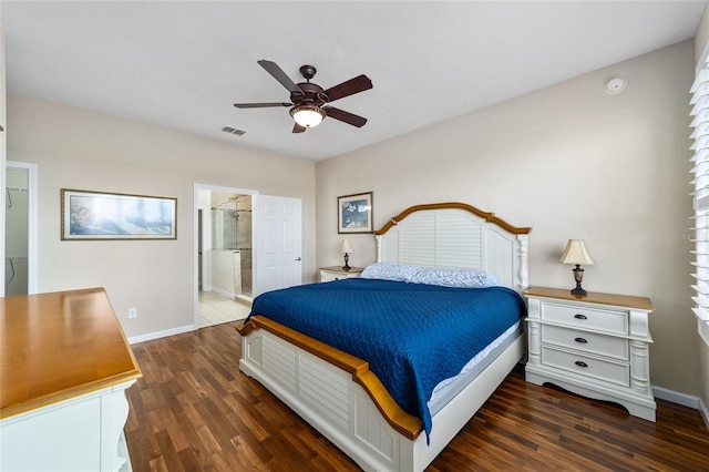 bedroom featuring ensuite bath, ceiling fan, and dark wood-type flooring