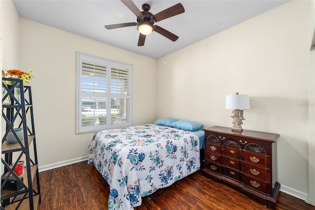 bedroom featuring ceiling fan and dark hardwood / wood-style floors