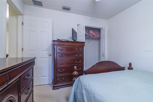 carpeted bedroom with a closet