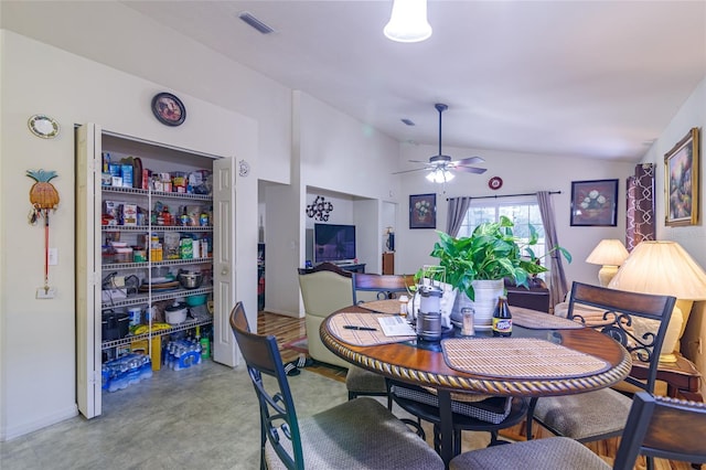 dining area featuring ceiling fan and vaulted ceiling