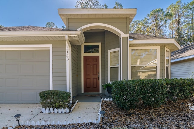 property entrance with a garage