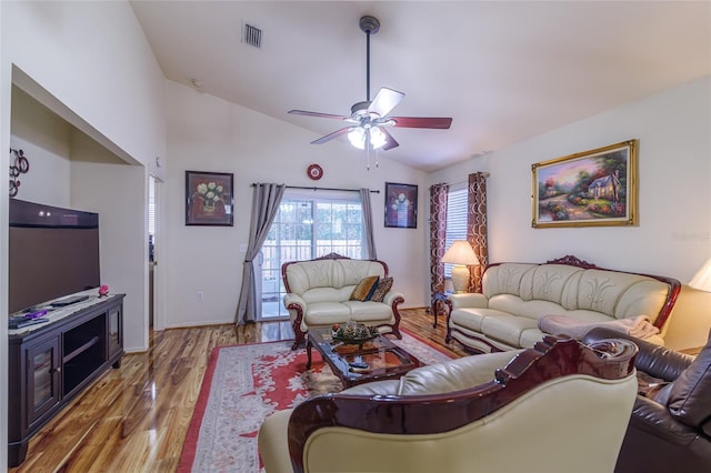 living room featuring wood-type flooring, ceiling fan, and lofted ceiling