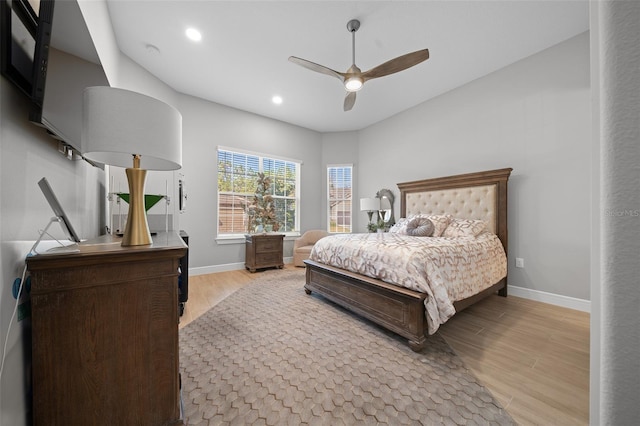 bedroom featuring ceiling fan and light hardwood / wood-style floors