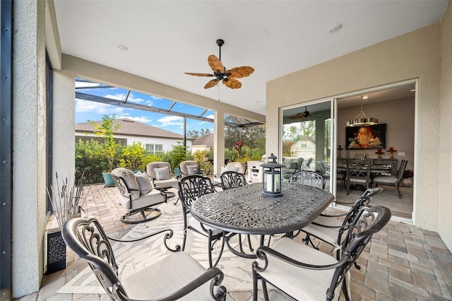 view of patio / terrace with glass enclosure and ceiling fan