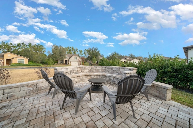 view of patio / terrace featuring a fire pit