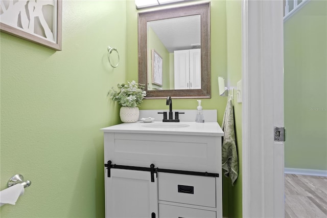 bathroom featuring vanity and wood-type flooring