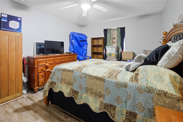 bedroom featuring wood-type flooring and ceiling fan