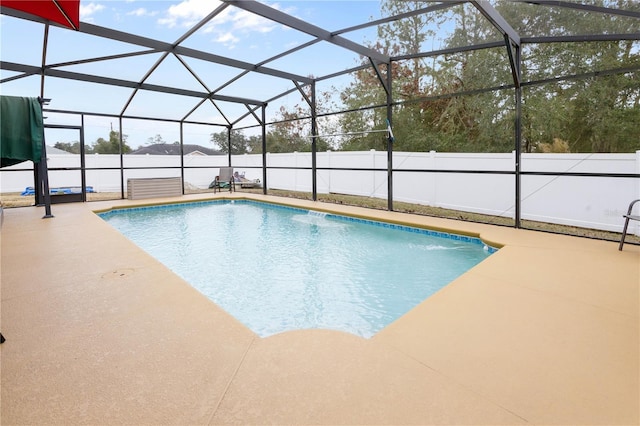 view of pool featuring a lanai and a patio area