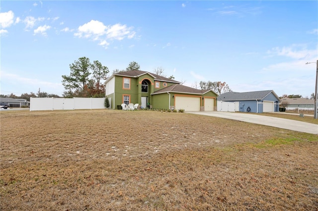 view of front facade featuring a garage and a front yard