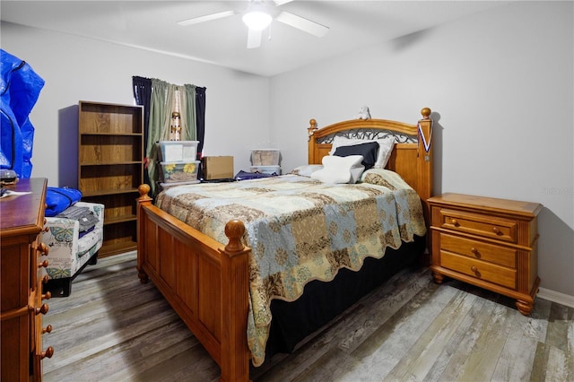 bedroom with wood-type flooring and ceiling fan