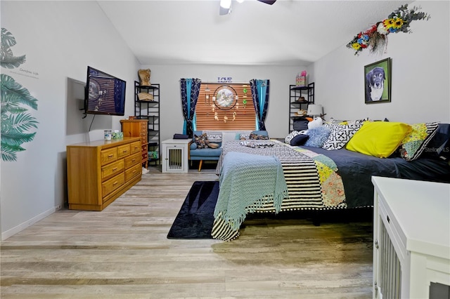 bedroom featuring light hardwood / wood-style floors and ceiling fan